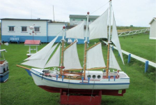 675: A model boat on Lawrence Barry's front lawn in St. Bride's. (2004)